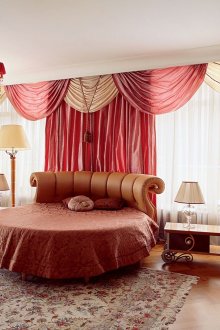 Beige and red curtains in a spacious bedroom